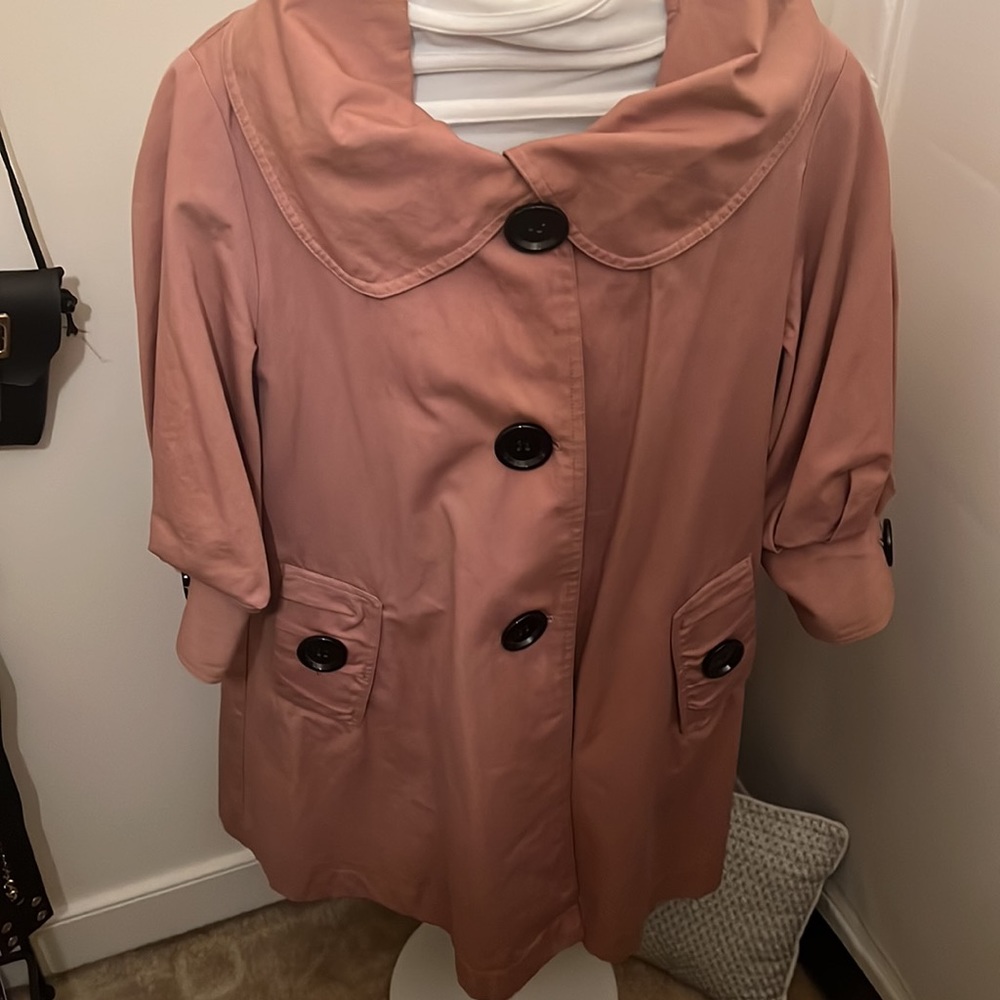 Quarter Sleeved, puffy, trench coat style jacket.